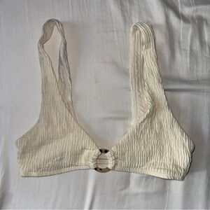 Beige bikini top with tortoise shell ring detail